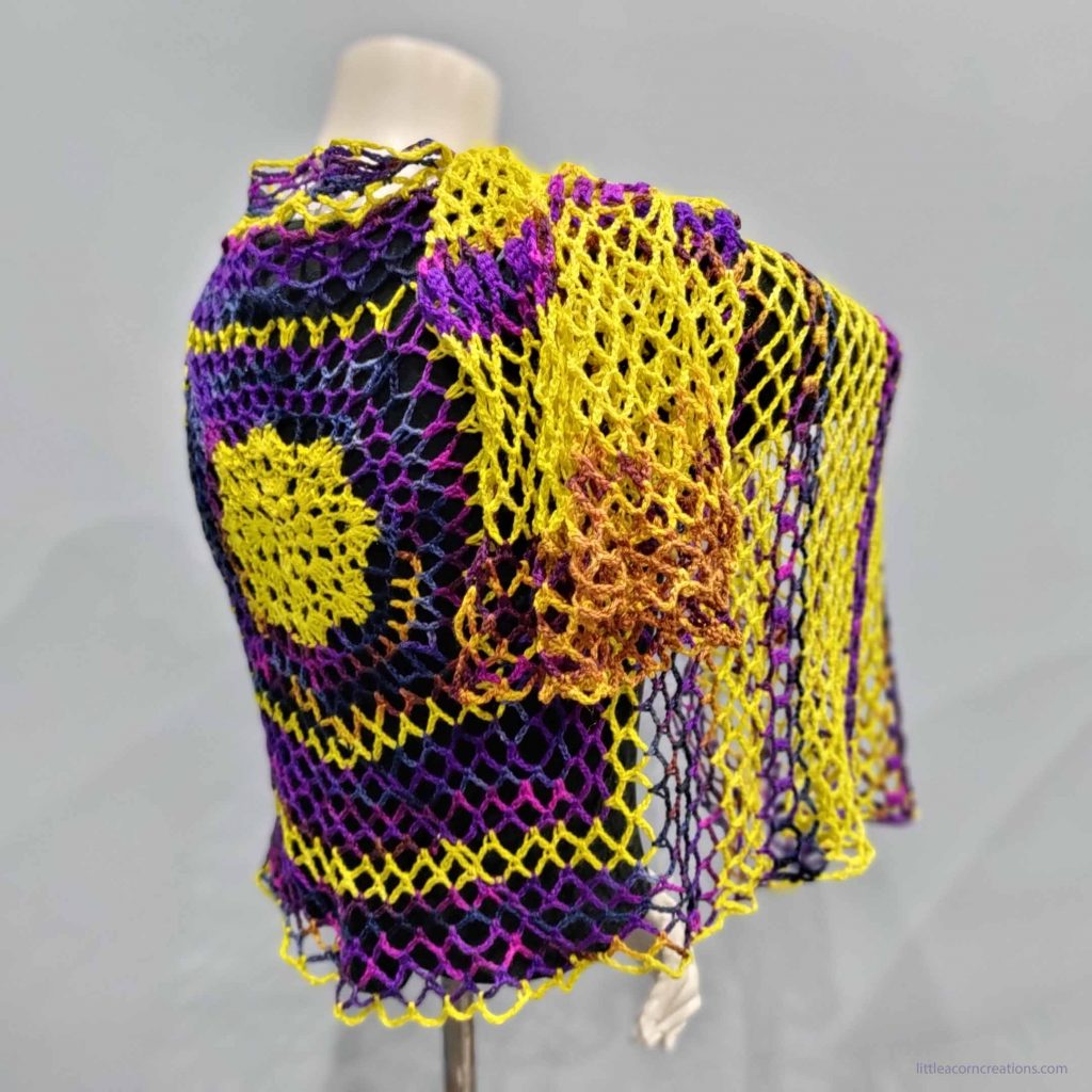 Northern Lights Wrap shown on a mannequin, turned slightly to show of drape