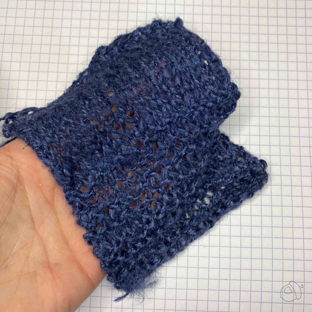 ColourMart fingering weight crepe style silk bakketta In dark navy showing drape