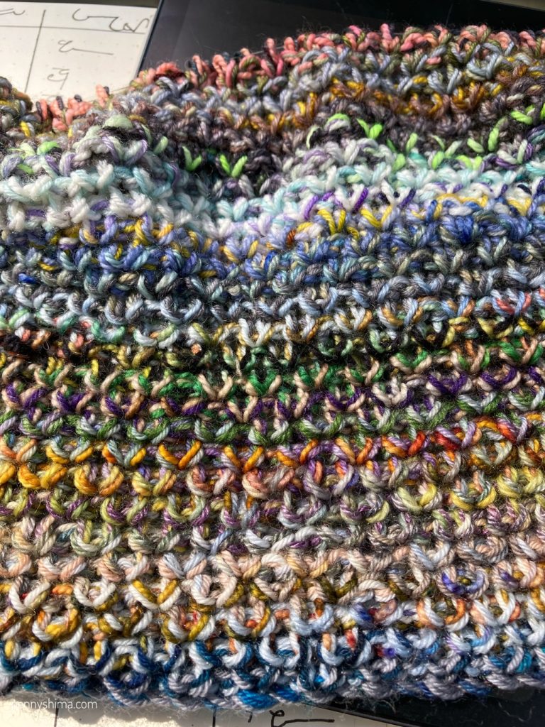 a multicoloured striped blanket