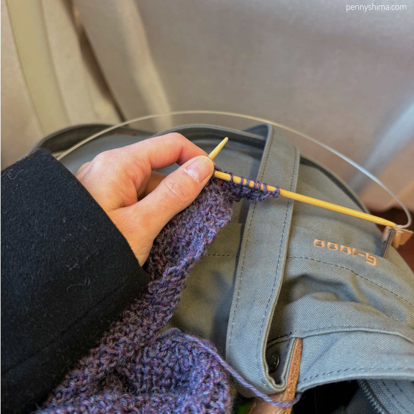 knitting a purple start with chai headband on the MNR train.