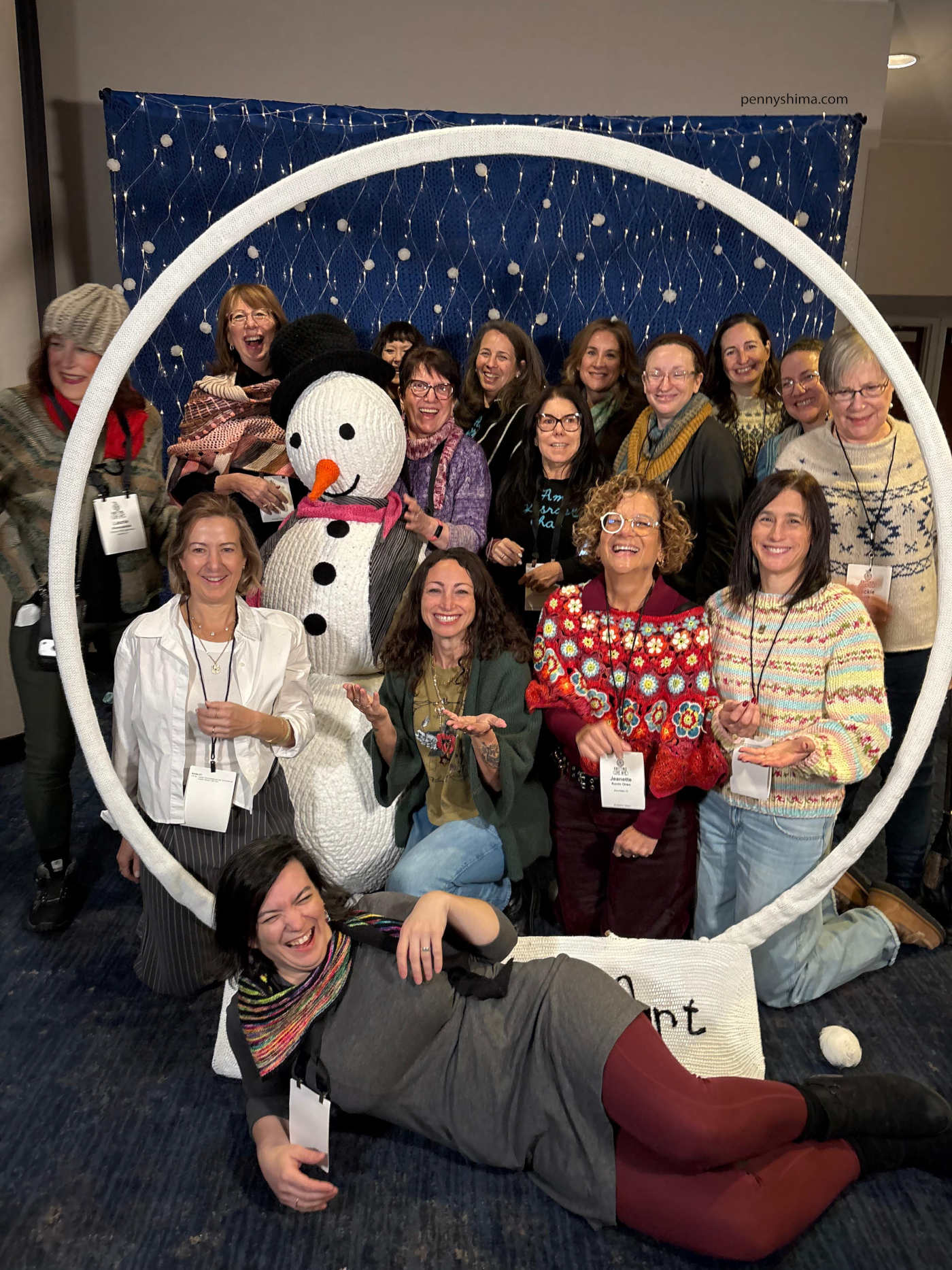 beautifully jewish group posing in sarah divi art's snow globe